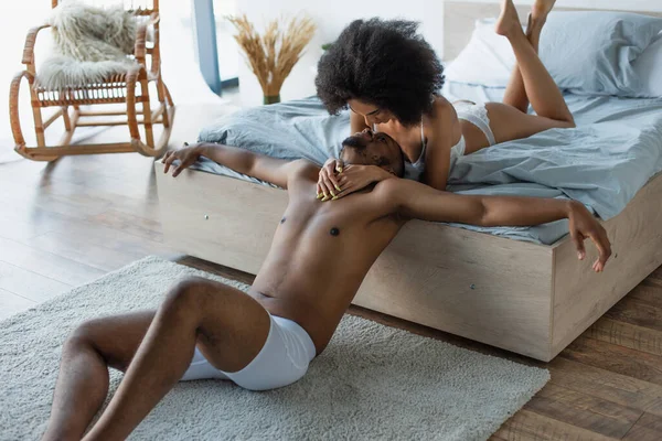 Young African American Woman Lingerie Embracing Boyfriend Bedroom — Stock Photo, Image