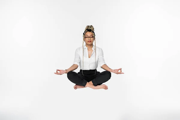 African American Businesswoman Closed Eyes Levitating Meditation Lotus Pose Isolated — Stock Photo, Image