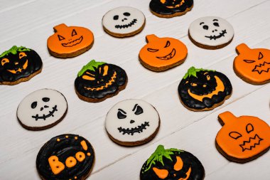 high angle view of homemade and tasty halloween cookies on white surface  clipart
