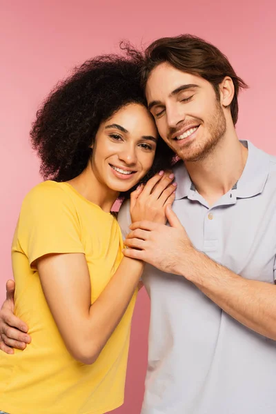 Happy Man Closed Eyes Hugging Pretty Hispanic Woman Looking Camera — Stock Photo, Image