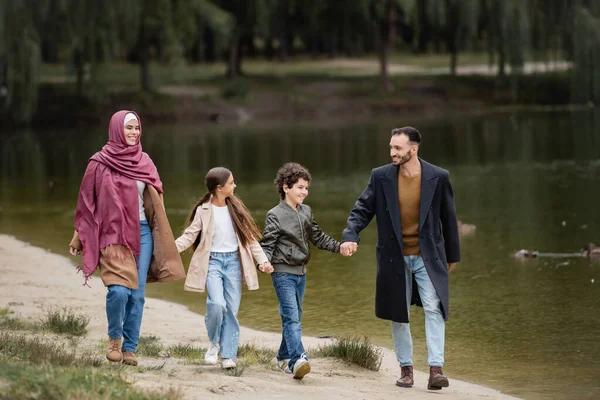 Happy Arabian Family Strolling Lake Park — Stock Photo, Image