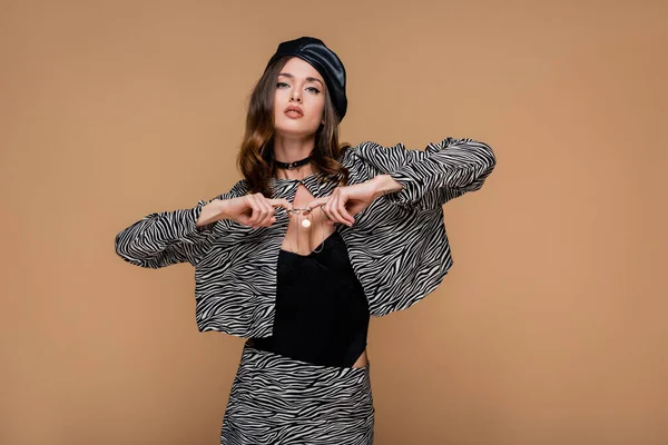 Young Woman Zebra Print Blazer Black Beret Pulling Necklace Isolated — Stock Photo, Image