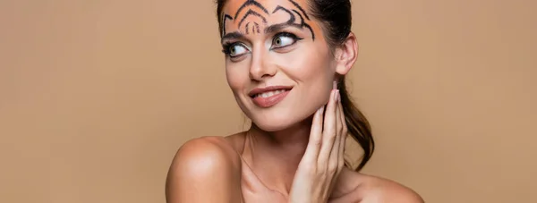 Cheerful Woman Bare Shoulders Tiger Makeup Looking Away Isolated Beige — Stock Photo, Image