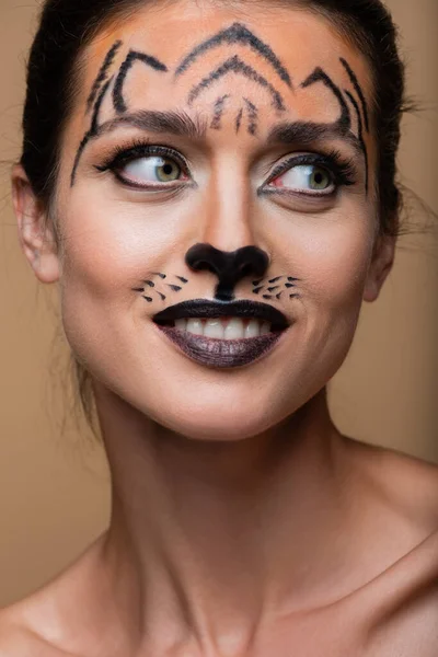 Close Joyful Woman Tiger Makeup Looking Away Isolated Beige — Stock Photo, Image