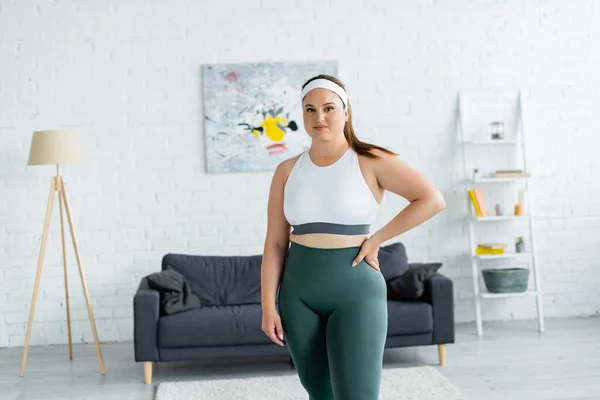 Smiling Sportswoman Overweight Holding Hand Hip Living Room — Stock Photo, Image