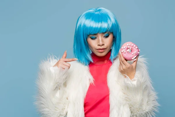 Stylish Asian Woman Fluffy Jacket Pointing Donut Isolated Blue — Stock Photo, Image
