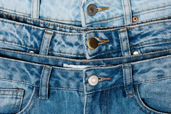 Close up view of various blue jeans — Stock Photo