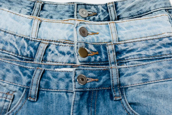 Close up view of different blue jeans — Stock Photo