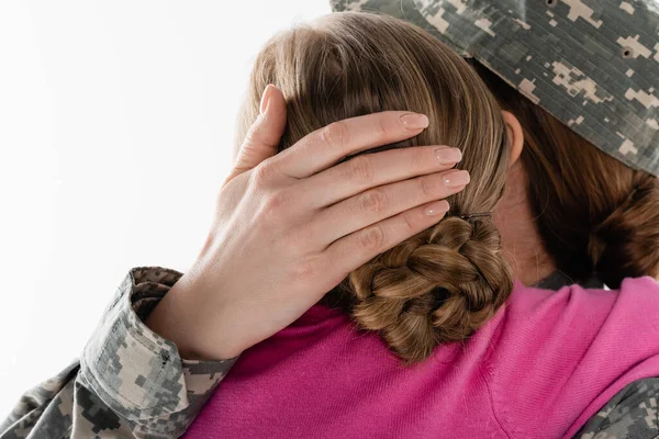 Mother in military uniform hugging kid isolated on white — Stock Photo