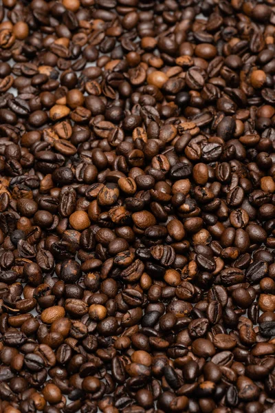 Top view of fresh and brown coffee beans — Stock Photo