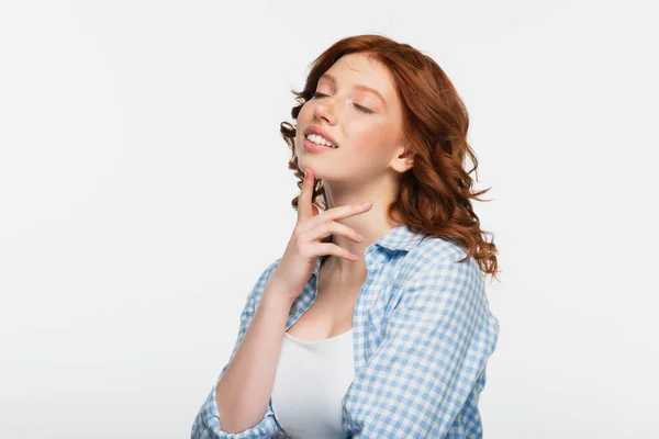 Happy redhead young woman with closed eyes isolated on white — Stock Photo