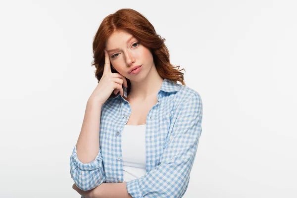 Thoughtful redhead woman in blue plaid shirt isolated on white — Stock Photo