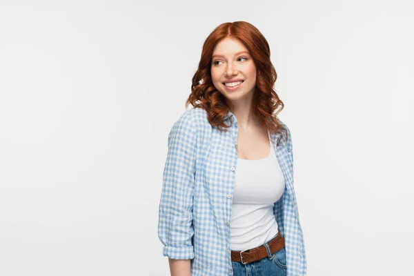 Young joyful redhead woman in plaid shirt isolated on white — Stock Photo