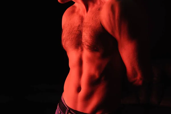 Cropped view of sexy shirtless man standing isolated on black — Stock Photo