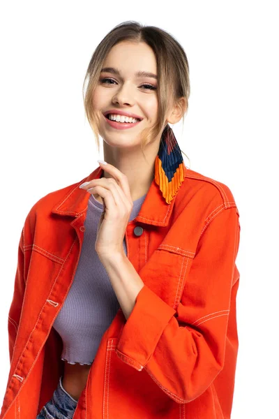 Positive young woman in crop top and orange shirt isolated on white — Stock Photo