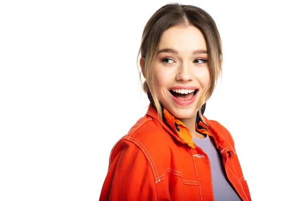 Amazed young woman in orange shirt isolated on white — Stock Photo