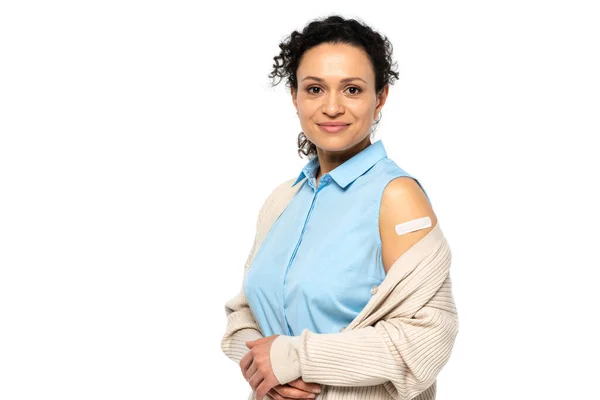 African american woman with adhesive plaster on arm smiling isolated on white — Stock Photo