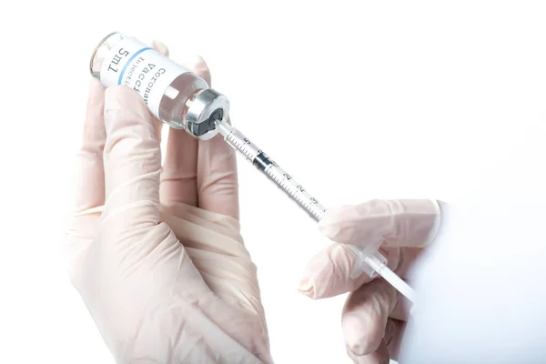 Cropped view of doctor picking up vaccine in syringe isolated on white — Stock Photo