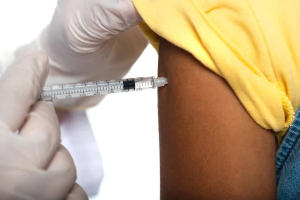 Cropped view of doctor doing injection with vaccine to african american girl isolated on white — Stock Photo