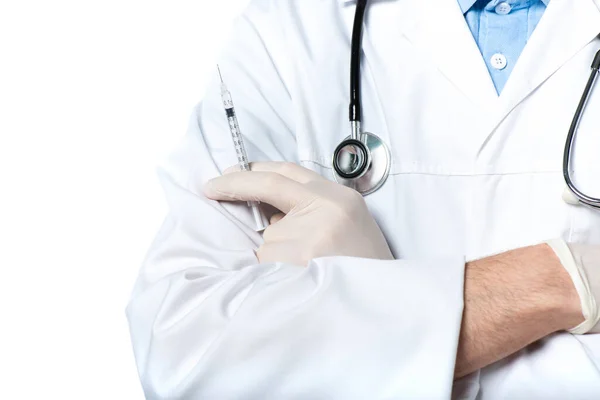 Cropped view of doctor with stethoscope holding syringe isolated on white — Stock Photo