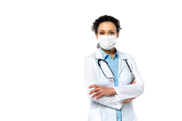 African american doctor in protective mask standing isolated on white — Stock Photo