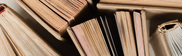 Top view of different books in hardcover on white, banner — Stock Photo