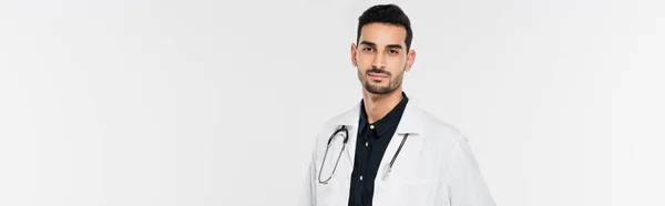 Muslim doctor with stethoscope isolated on grey, banner — Stock Photo