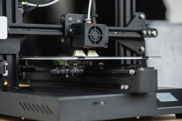 Close up view of 3D printer creating plastic model on blurred background — Stock Photo