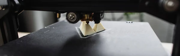 Close up view of 3D printer creating plastic model on blurred background, banner — Stock Photo