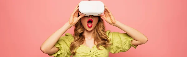 Shocked woman in vr headset isolated on pink, banner — Stock Photo
