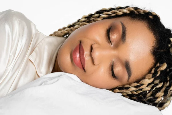 Close up portrait of young african american woman with dreadlocks sleeping isolated on white — Stock Photo