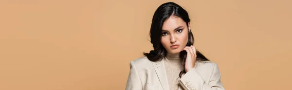 Pretty young model in turtleneck and blazer isolated on beige, banner — Stock Photo