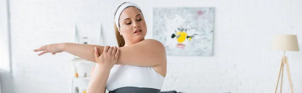 Plus size woman training in living room, banner — Stock Photo