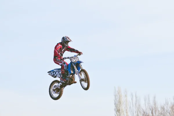 Motocross bike jump against the sky — Stock Photo, Image