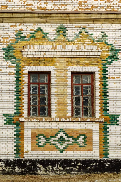 The facade of an old building is faced with glazed bricks. Steppe Zeikhgauz. The picture was taken in Russia, in the city of Orenburg