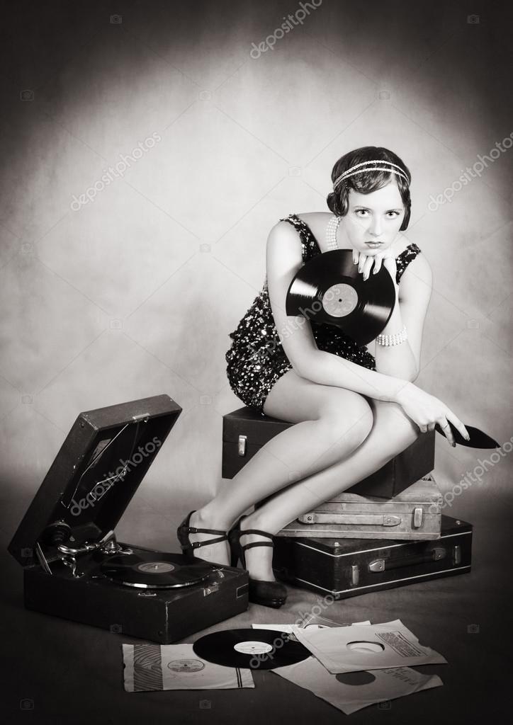 https://st2.depositphotos.com/4617943/9583/i/950/depositphotos_95830004-stock-photo-girl-with-gramophone-and-a.jpg