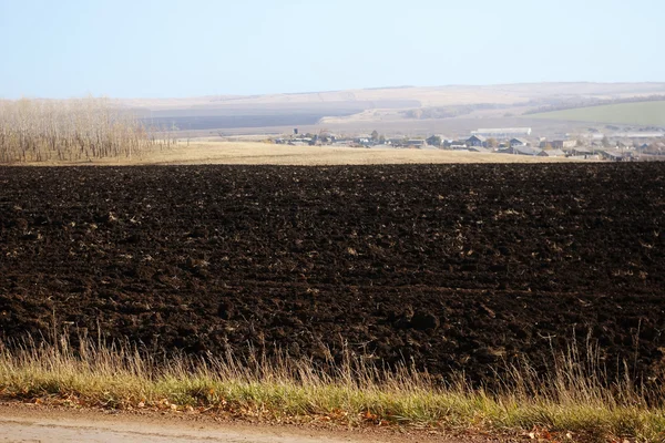 Autumn Landscape with a plowed field — Stock Photo, Image