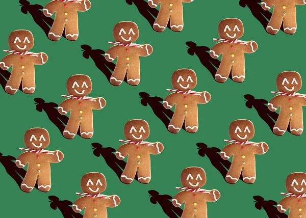 Kurabiye Adam, yaratıcı, minimal yemek fotoğrafçılığı düzlüğü. Pastel yeşil arkaplan.