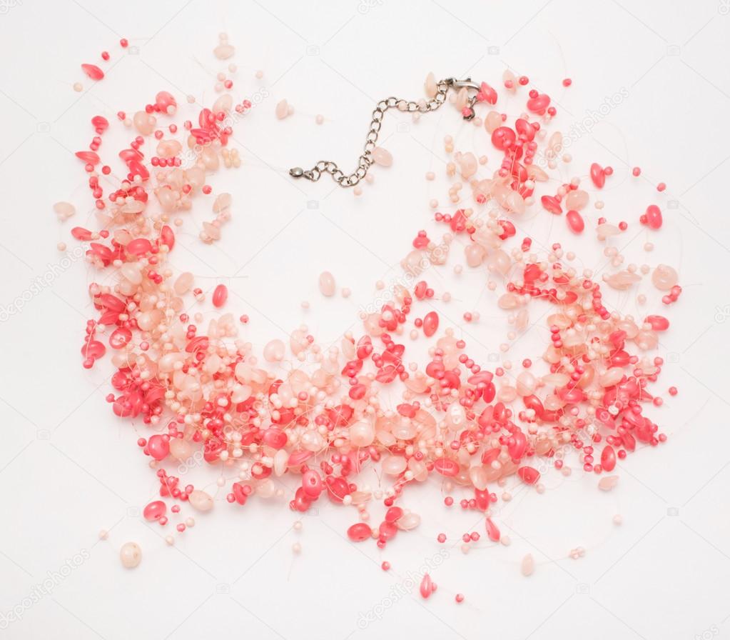 Beautiful and stylish rose necklace on white background