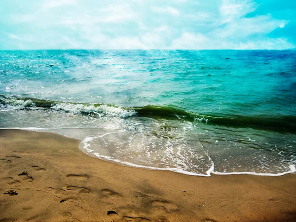 Footsteps on the sand of beautiful seaside