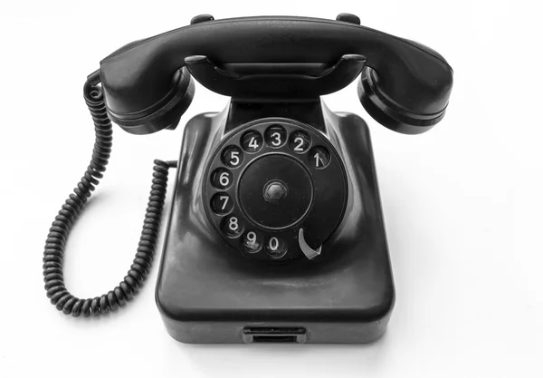 Beyaz arkaplanda eski telefon 