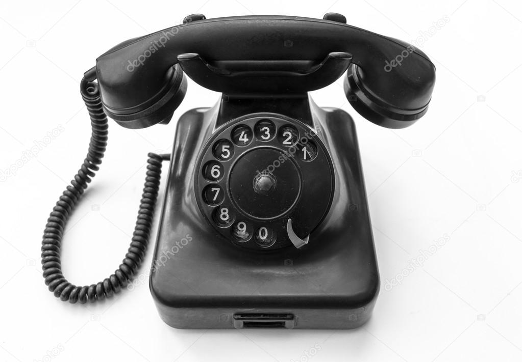 Old telephone on white background 