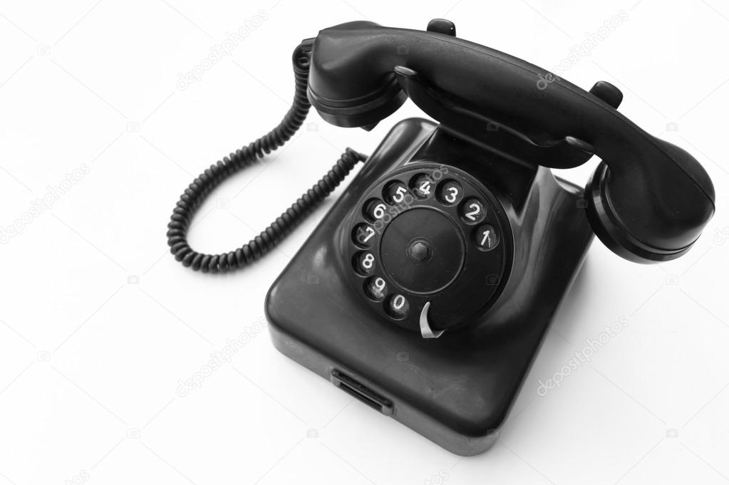 Old telephone on white background 