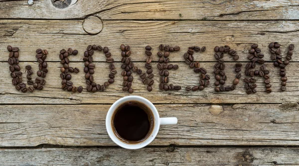 Taza de café sobre fondo de madera —  Fotos de Stock