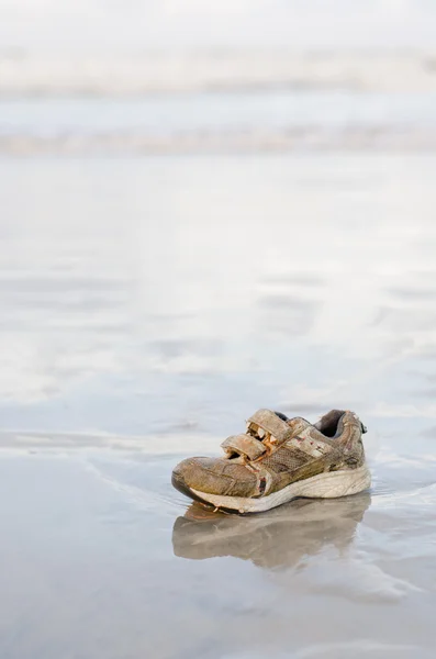 Stranded children sport shoe — Stock Photo, Image