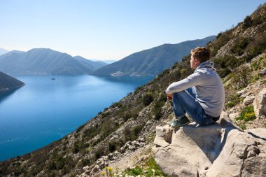 A man contemplating sea bay