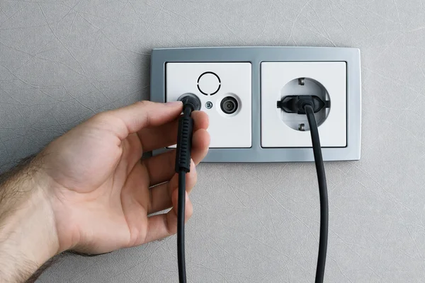Plugging cable to outlet — Stock Photo, Image