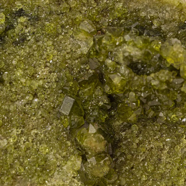 macro view of green crystals of mineral sample