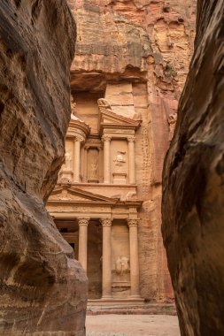 Hiking through the canyon in the ancient city of Petra (Jordan)  clipart