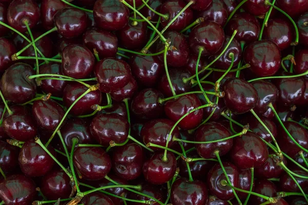 Ripe red cherries in the market on the counter — Stock Photo, Image